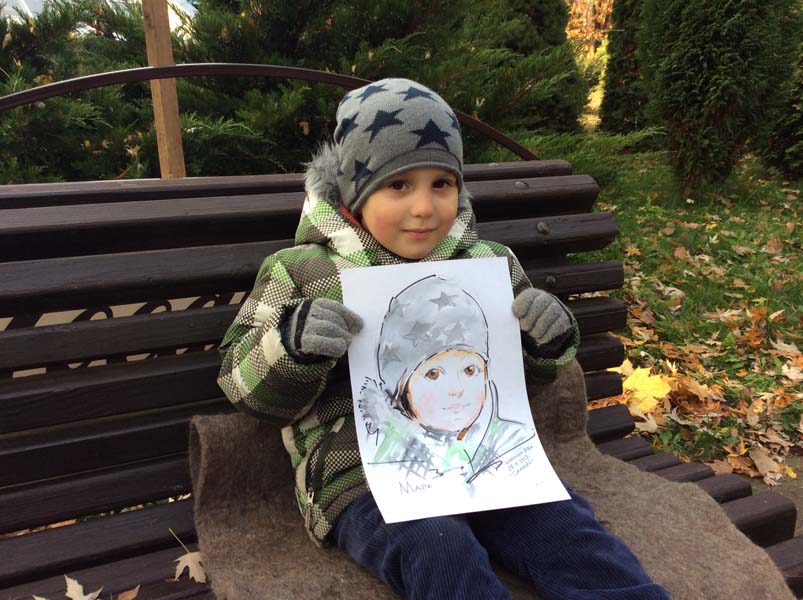 Марк позирует шаржисту Мишелю на корпоративе